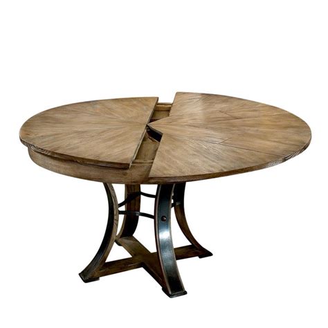 Butterfly leaf folds in half to store in a more compact space. Rustic Metal and Wood Round Dining Table, Self Storing Leaves