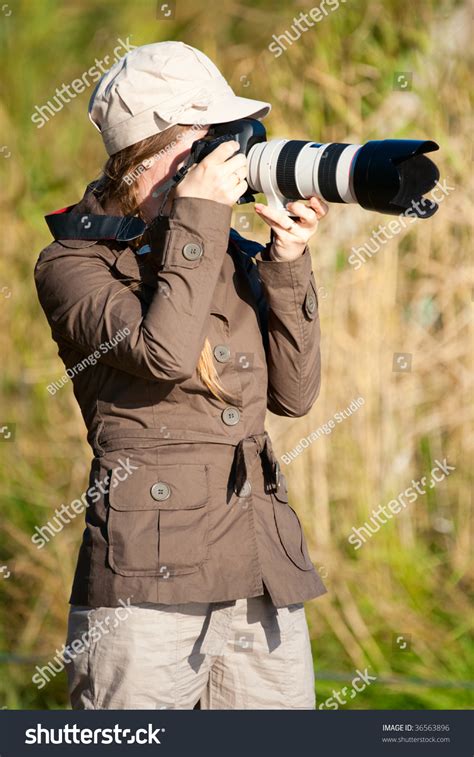 Beautiful Young Female Nature Photographer Outdoors Stock Photo