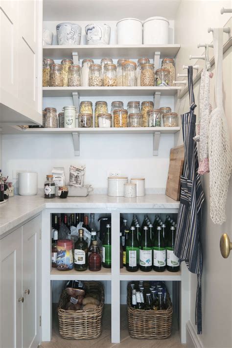 Storage pantries slide out from under the stairs to show off shelves that can house most any sized food items. Plain English Kitchen in Brooklyn: An Old-Style Townhouse ...