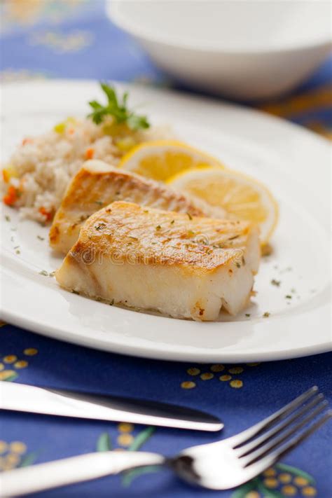 Fish like cod and mackerel will be white all the way through. Cooked cod fish stock image. Image of meal, baked, plate ...