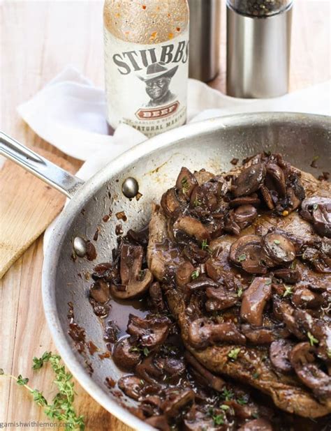 Pan Seared Flank Steak with Red Wine Mushroom Sauce - Garnish with Lemon