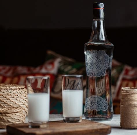 Free Turkish Vodka Raki In Glasses With A Bottle Aside Free Photo