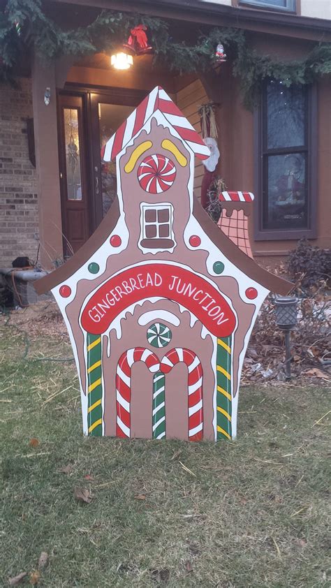 The yard is surrounded with a candy cane fence. Gingerbread House Cottage Depot Train Station Christmas ...