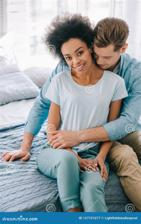Young Tender Multiracial Couple Hugging Stock Image Image Of Interior