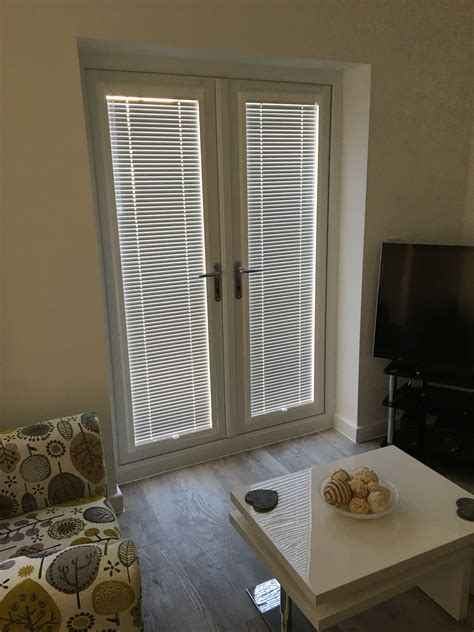 Adding Style And Functionality To Your Kitchen Patio Door With Blinds