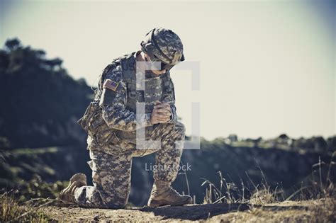 Soldier Kneeling In Prayer — Photo — Lightstock