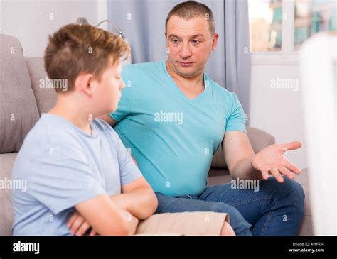 Man With His Adult Son Are Serious Talking About Life Together At The