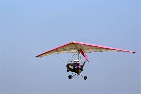 Ultralight Airplane Flying In A Blue Sky Stock Photo Image Of