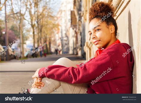 african preteen girl sitting alone sidewalk foto stok 792683242 shutterstock