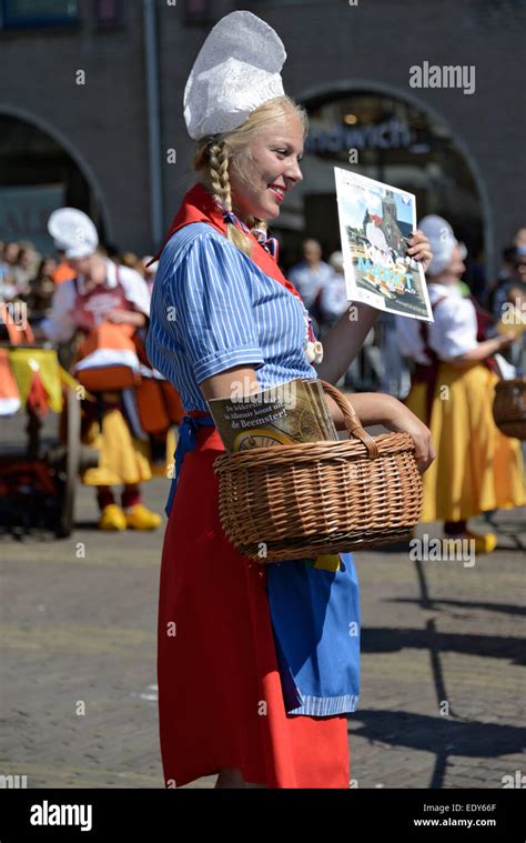 Girl In Traditional Dutch Costume At The Cheese Market Waagplein Square Alkmaar North Holland