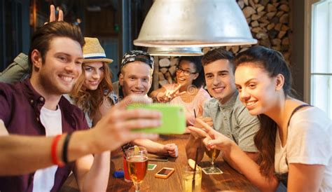 Happy Friends With Smartphone Taking Selfie At Bar Stock Image Image Of Drinking Glasses