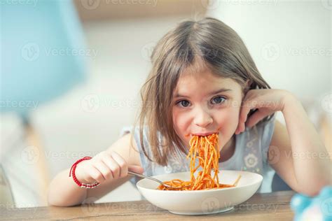 Cute Little Kid Girl Eating Spaghetti Bolognese At Home 27543746 Stock