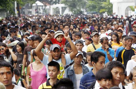 Thousands Of Filipinos Troop To A Public Cemetery To Visit Their