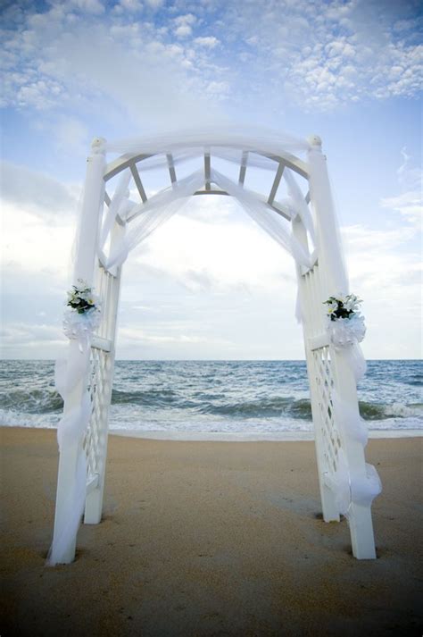 A Sweet And Simple White Tulle Arch With Greens Speaks