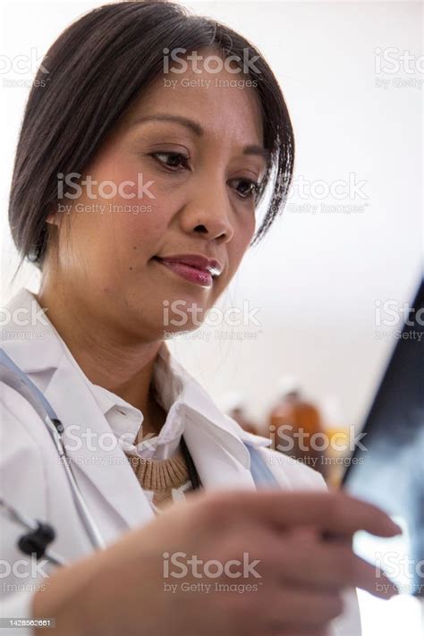 Close Up Female Doctor Looking At Xray Stock Photo Download Image Now