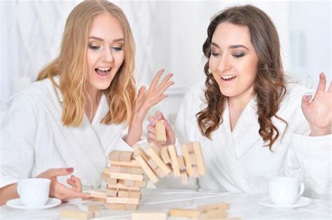 Premium Photo Women Playing With Blocks