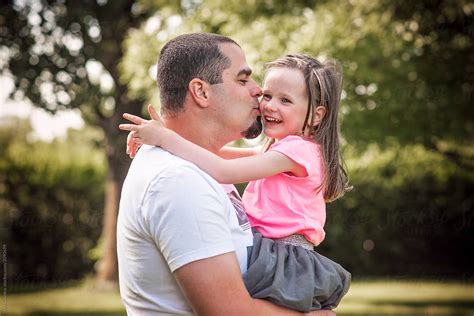 Father Hugging And Kissing Her Daughter By Stocksy Contributor Lea Csontos Stocksy