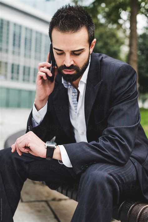 Businessman Using The Mobile Phone For A Call By Stocksy Contributor