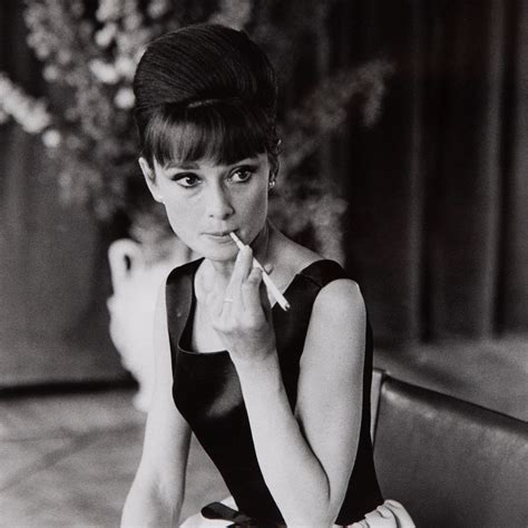 The Enchantment Of Audrey Hepburn — Audrey Hepburn Sits Smoking A