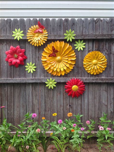 Raise your garden game to another level with garden statues and sculptures. Summer Fun Metal Flower Fence Art - Marigold Red Flowers w ...