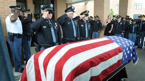 Thousands Turn Out For Miss Police Officers Funeral
