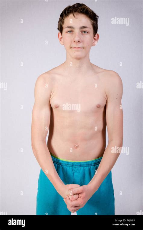 Shirtless Teenage Boy Flexing His Muscles Stock Photo Alamy