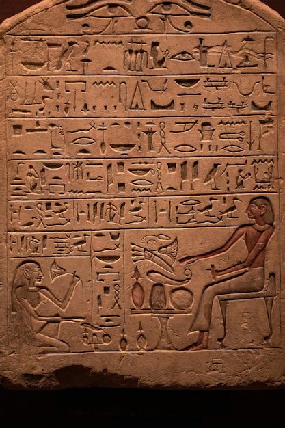 Premium Photo Egyptian Hieroglyphs On A Sandstone Slab In The Rays Of