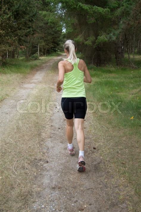 Blond Girl Running In Wood Stock Image Colourbox