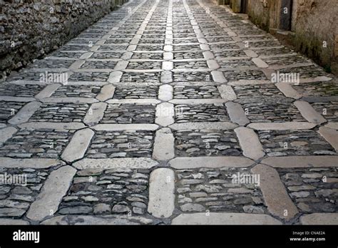 Paved Stone Road Street Background In Erice Sicily Italy Stock Photo
