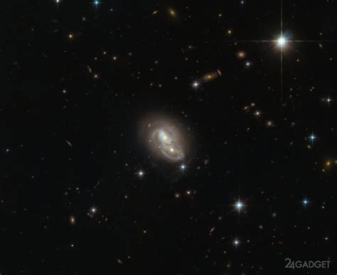 Hubble Captures Two Galaxies Passing 2 Photos Gadgets F