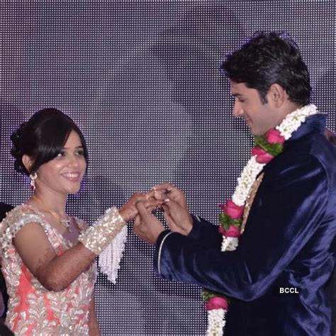 mrunal jain slips a ring on his fiancee sweety jain s finger during the engagement ceremony