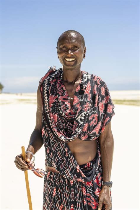 African Man Masai Dressed In Traditional Clothes Standing Near The