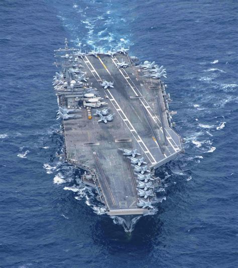 Shadowed By Dragon Us Nimitz Class Aircraft Carrier Back In Focus As