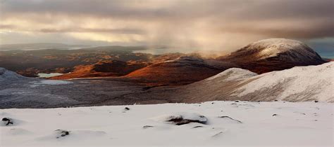 Vast Panorama Of The Snow Covered North West Highlands With The View To