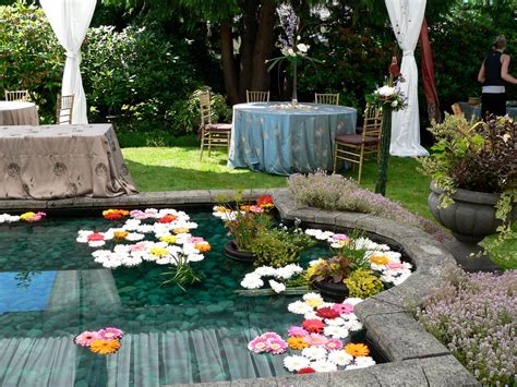 Floating Flowers On The Reflecting Pool For A Summer Wedding Floating