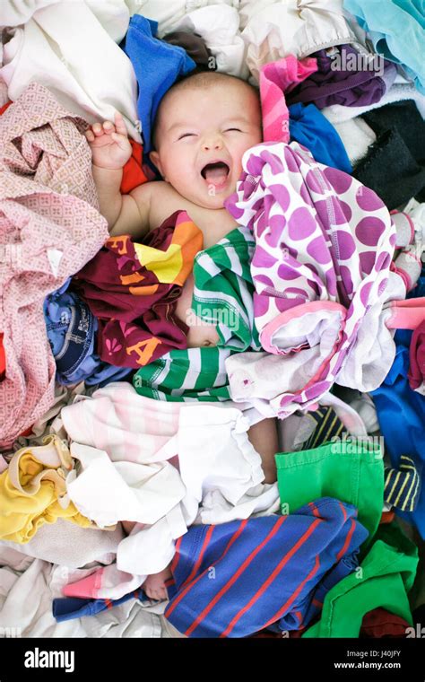 Overhead Portrait Of Baby Girl Lying In Laundry Stock Photo Alamy