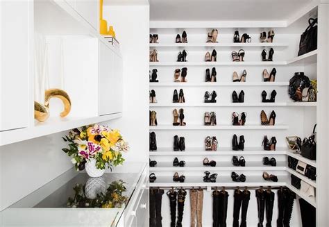 Once all the shelves are in place, start adding the finish pieces. Custom floor to ceiling shoe shelves in a walk-in closet ...