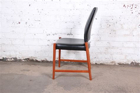 torbjorn afdal teak and black leather dining chairs set of four at 1stdibs