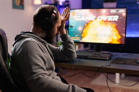 Sad Gamer Losing Video Games Play On Computer Stock Photo By Dcstudio