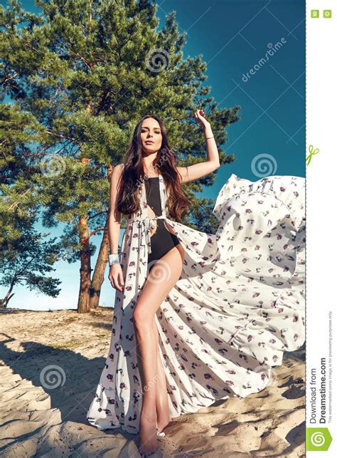 Beautiful Woman Tanned Perfect Body Silk Dress Beach Sand Stock Image