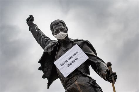 Photos Famous Statues Add A Face Mask For Coronavirus Message