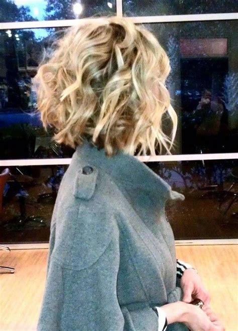 Short curly permed hairstyle with long bangs. 21 Lively Short Haircuts for Curly Hair | Styles Weekly