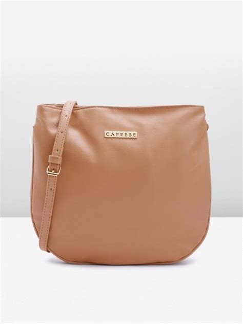Buy Caprese Nude Coloured Synthetic Leather Solid Sling Bag Online At