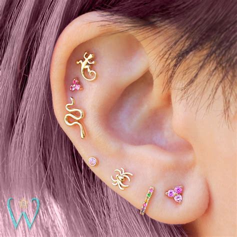 An industrial piercing (north america), sometimes called a scaffold piercing (uk/ireland) or construction piercing, is any two pierced holes connected with a single straight piece of jewelry (compare to orbital piercing); Snake Stud Earring is perfect anyone who has a creative ...