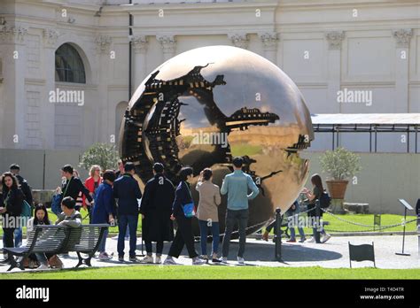 Some People Looking At A Strange Sculpture In The Vatican Stock Photo