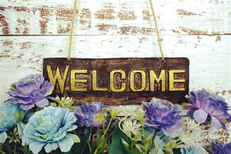 Welcome Sign With Flowers Frame Decorate On Pink Background Stock Image