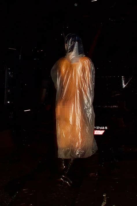 Watch Bianca Censori Puts Everything On Display In A Clear See Through Raincoat While Out With