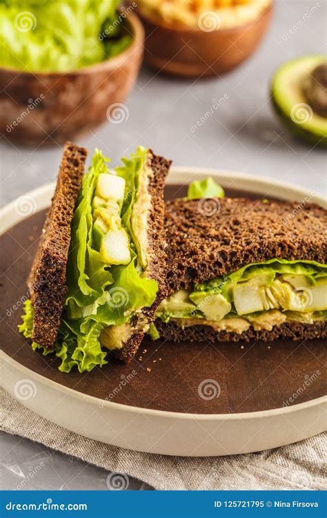 Vegan Green Sandwiches With Hummus Baked Vegetables And Avocado Stock