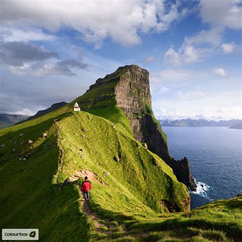 Hiking Towards The Kallur Lighthouse On The Kalsoy Island Within The