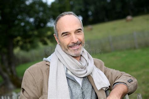 Happy Mature Man Leaning On Fence Outdoor Stock Image Image Of Smile Male 33878361